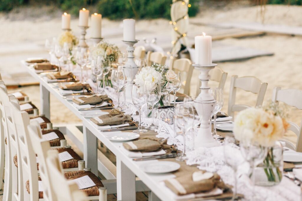 long-dinner-table-decorated-with-flaxen-cloth-white-candles_1304-3245